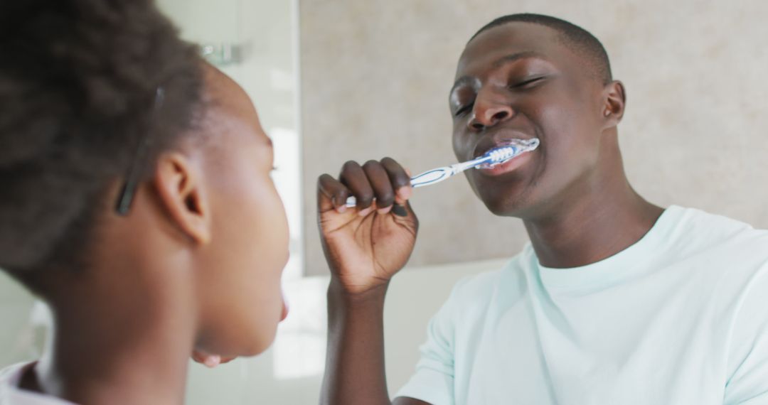 Morning Routine with Couple Brushing Teeth Together in Bathroom - Free Images, Stock Photos and Pictures on Pikwizard.com