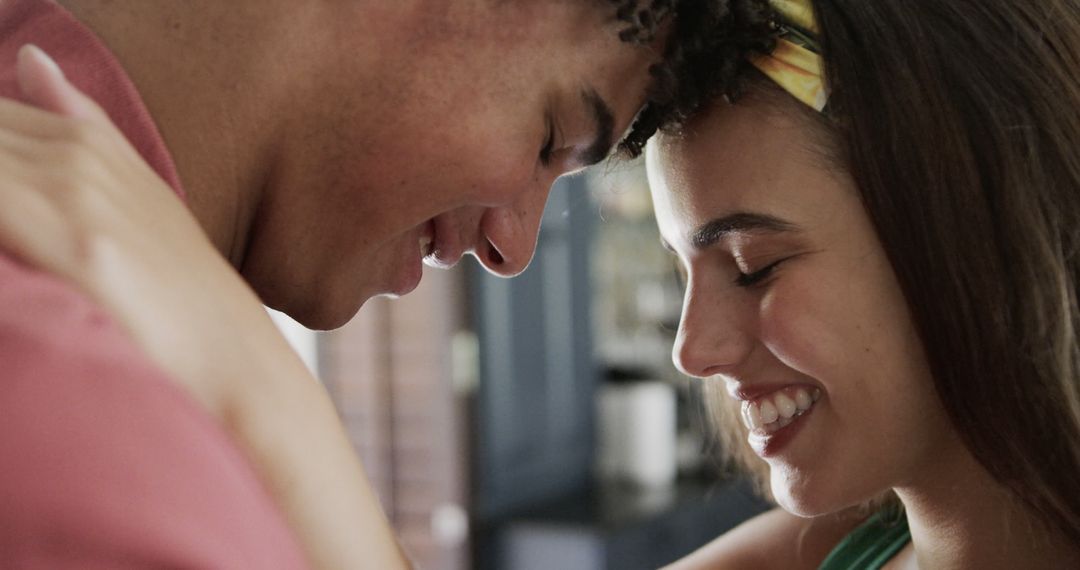Joyful Biracial Couple Embracing at Home