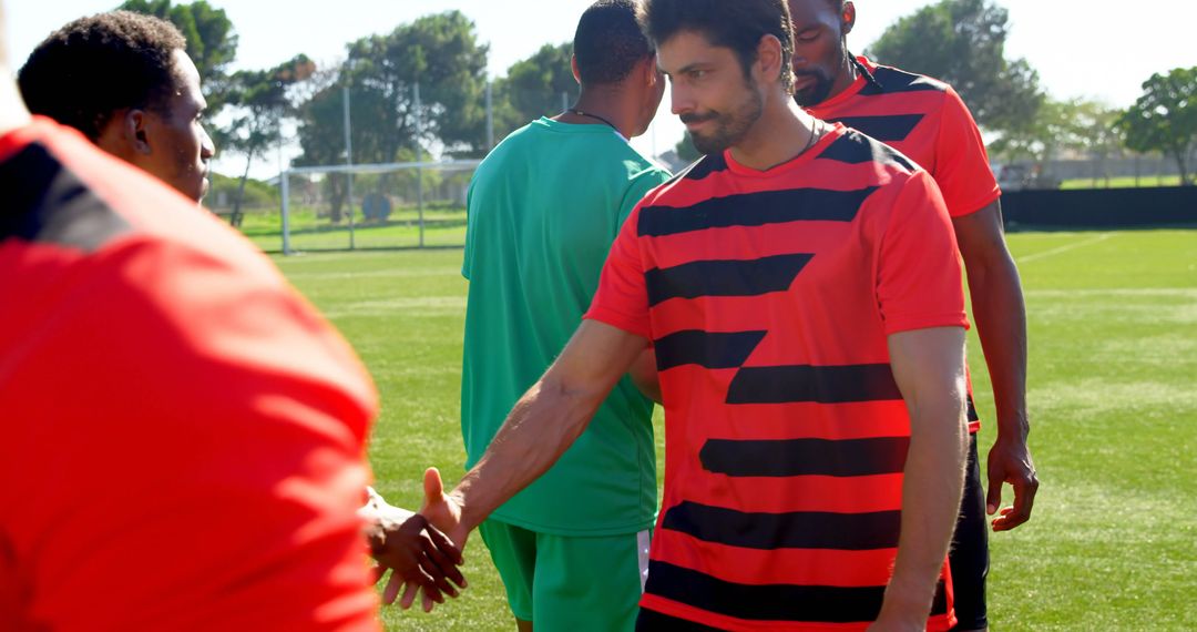 Soccer Players Shaking Hands During Outdoor Practice Session - Free Images, Stock Photos and Pictures on Pikwizard.com