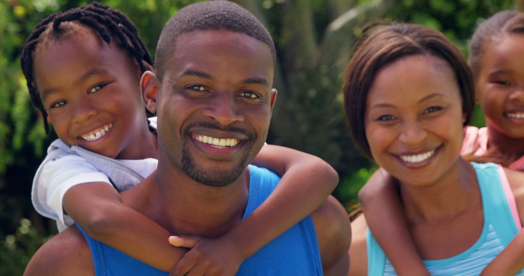 Happy African American Family Smiling Together Outdoors - Free Images, Stock Photos and Pictures on Pikwizard.com