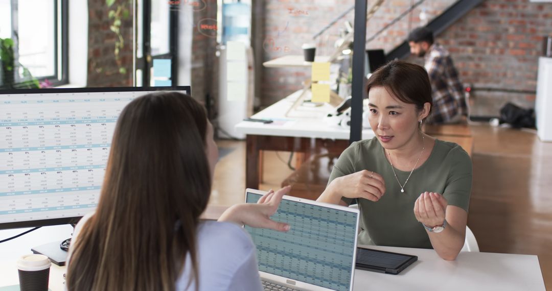 Diverse Professional Team Collaborating in Modern Office Environment