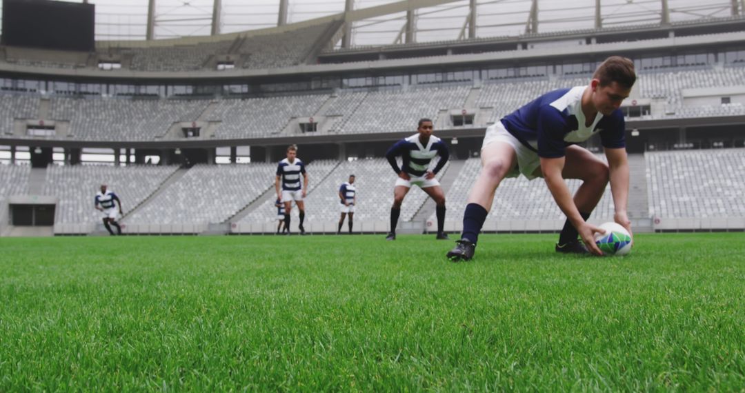 Group of Rugby Players Practicing in Stadium