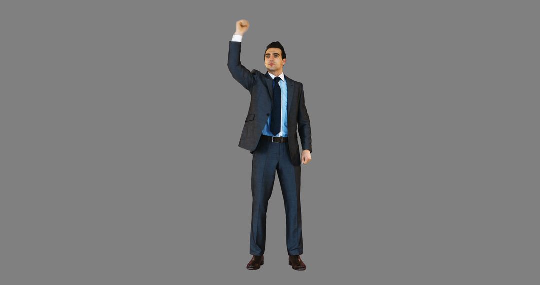 Confident Businessman Raising Fist in Victory Pose - Free Images, Stock Photos and Pictures on Pikwizard.com