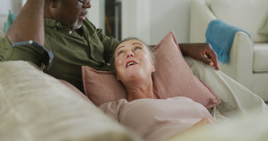 Senior Couple Relaxing and Bonding on Comfortable Couch