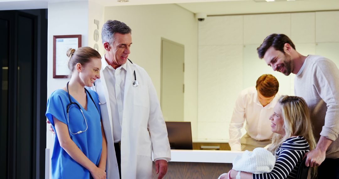 Doctor and Nurse Congratulating New Parents in Hospital - Free Images, Stock Photos and Pictures on Pikwizard.com