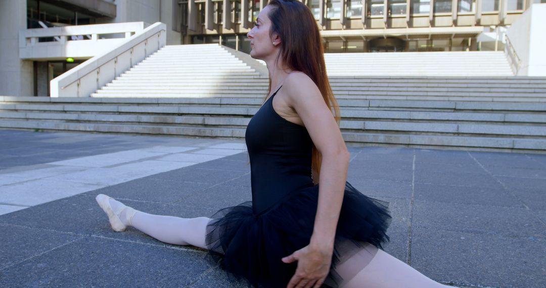 Ballet Dancer Practicing Splits Outdoors in Urban Area - Free Images, Stock Photos and Pictures on Pikwizard.com