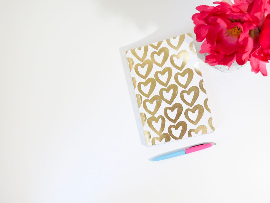 Stylish Notebook with Heart Pattern and Vibrant Pink Flowers