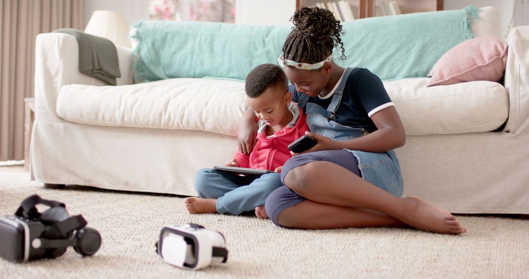 Mother and Child Engaging with Tablet and VR Headsets Indoors - Free Images, Stock Photos and Pictures on Pikwizard.com