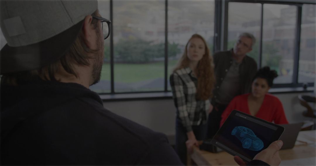 Creative Team Analyzing Car Design Using Tablet Technology