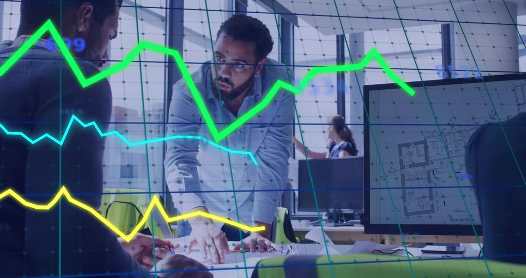 Middle Eastern Architect Reviews Blueprints with Data Visualization