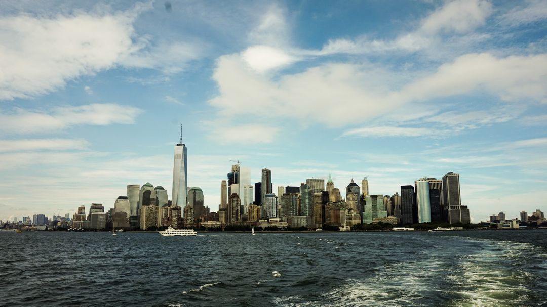 Skyline of Manhattan Viewed from the Water with the One World Trade Center - Free Images, Stock Photos and Pictures on Pikwizard.com