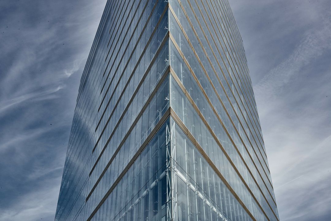 Modern Glass Skyscraper Against Dramatic Sky - Free Images, Stock Photos and Pictures on Pikwizard.com