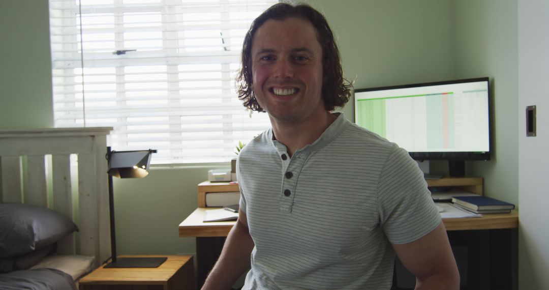 Smiling Man with Disability Working at Home Office