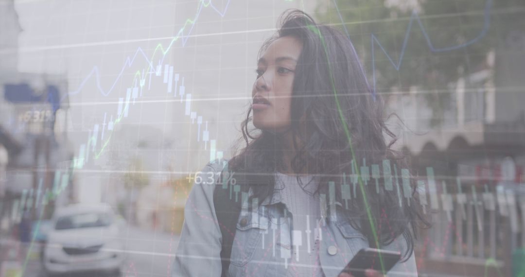 Businesswoman Analyzing Stock Market Trends Outdoors - Free Images, Stock Photos and Pictures on Pikwizard.com