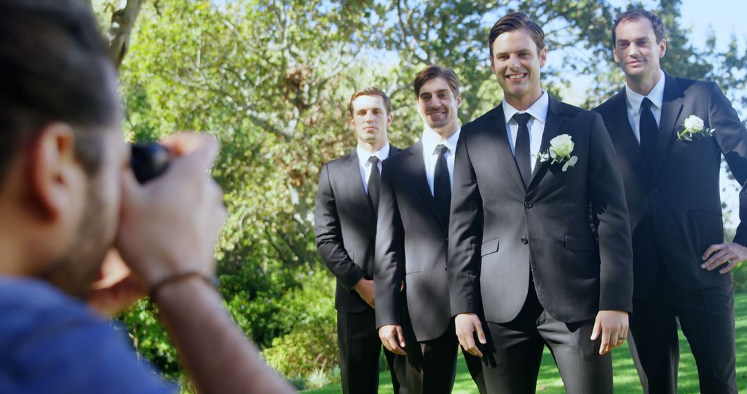 Groomsmen Smiling for Photographer in Outdoor Wedding - Free Images, Stock Photos and Pictures on Pikwizard.com