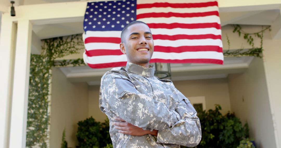 Confident Young Soldier Smiling in Army Uniform in Front of US Flag - Free Images, Stock Photos and Pictures on Pikwizard.com