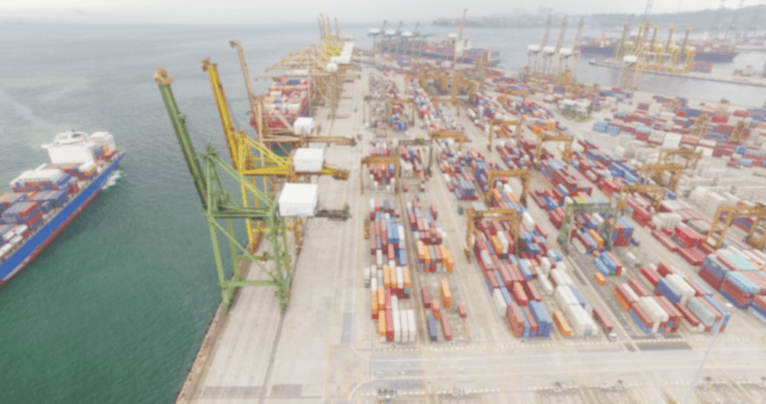 Transparent Aerial View of Cargo Containers at Busy Dock