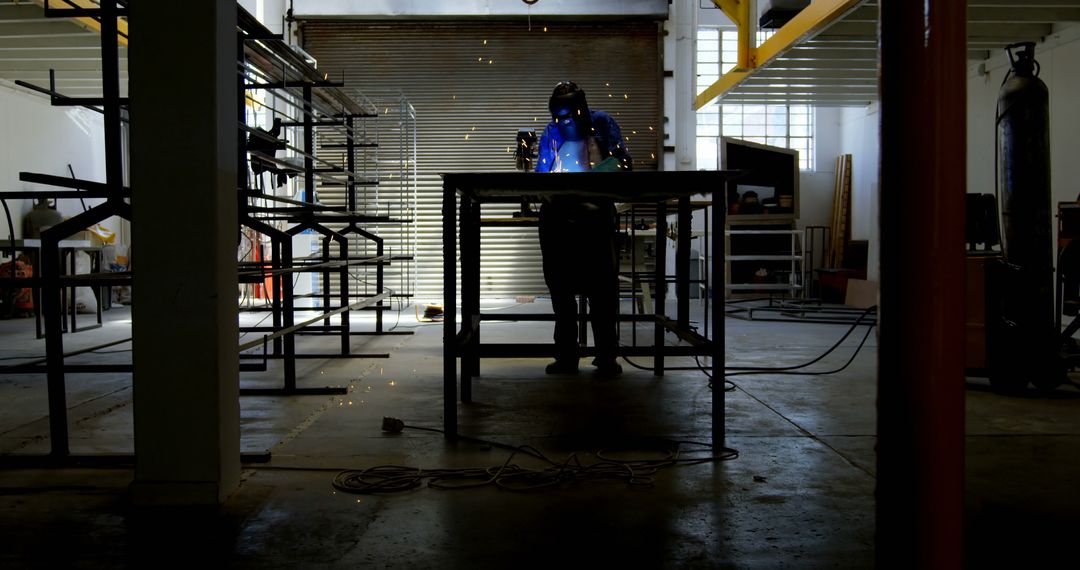 Welder at work in an industrial setting, with copy space - Free Images, Stock Photos and Pictures on Pikwizard.com