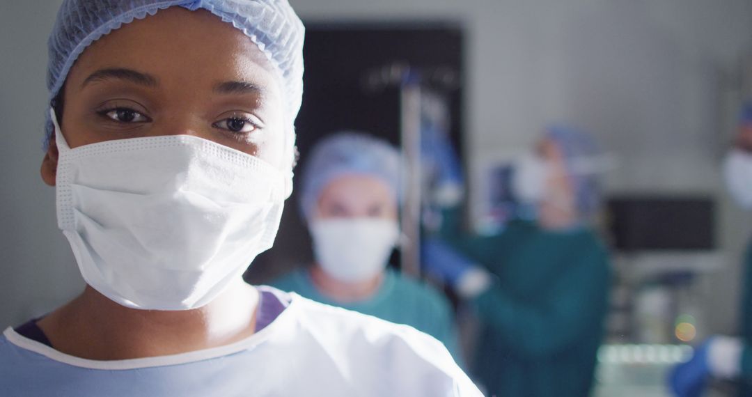 African American female surgeon is portrayed in an operating theatre with space for text. - Free Images, Stock Photos and Pictures on Pikwizard.com