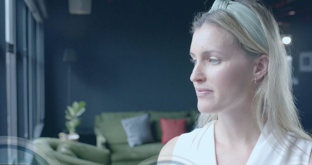 Businesswoman with Digital Security Symbols in Modern Office