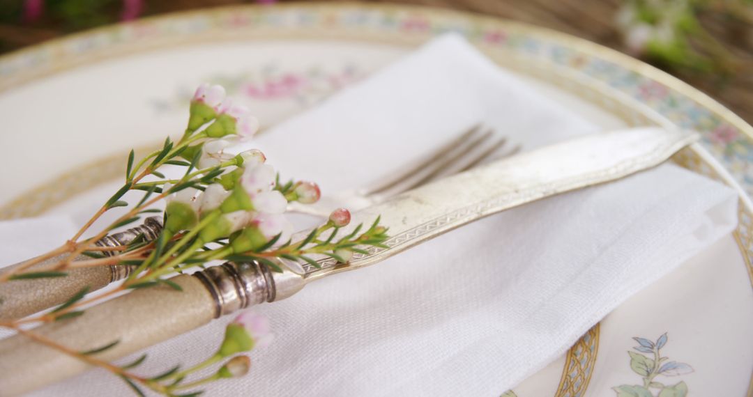 Elegant Table Setting with Vintage Cutlery and Floral Decor - Free Images, Stock Photos and Pictures on Pikwizard.com