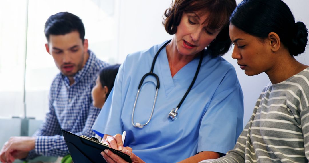 Nurse Discussing Medical Notes with Patient in Clinic - Free Images, Stock Photos and Pictures on Pikwizard.com