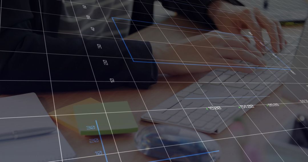 Tech Professional Using Keyboard with Digital Interface Overlay