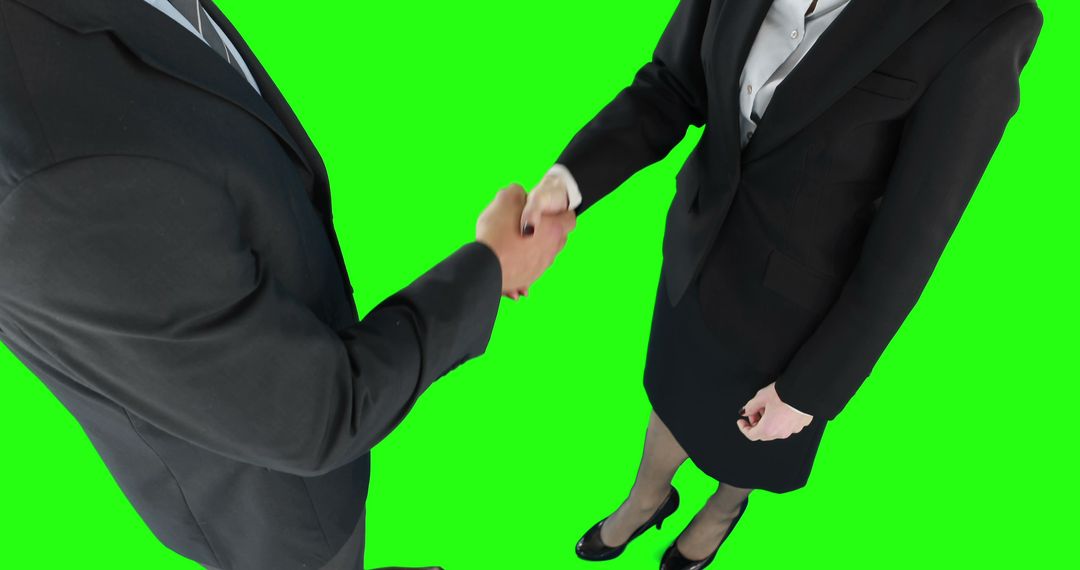 Businessmen Shaking Hands on Green Screen with Copy Space