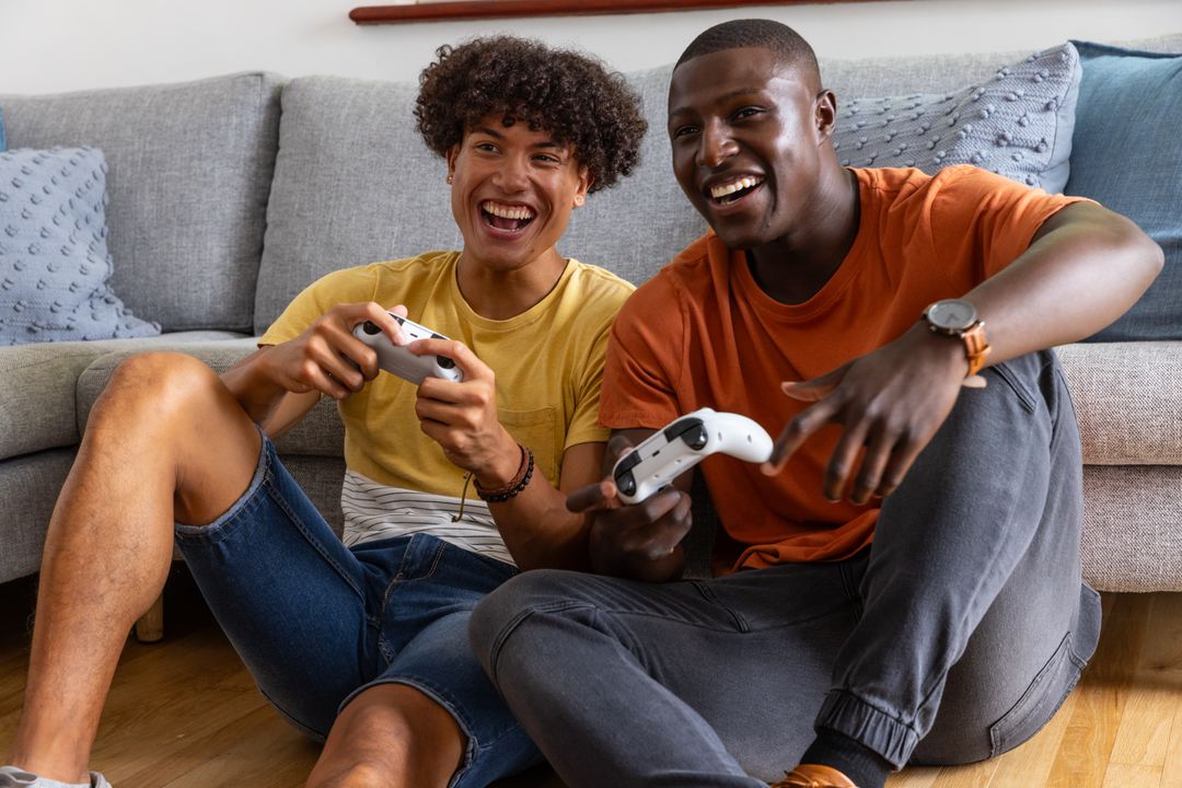 Diverse Young Friends Enjoying Video Game Session at Home