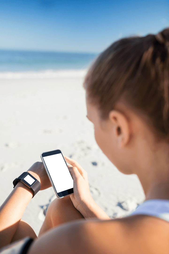 Woman Using Smartphone on Sunny Beach with Scenic View