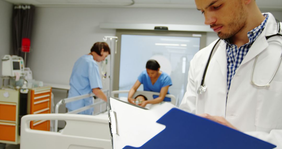 Medical Team Caring for Patient in Hospital Room - Free Images, Stock Photos and Pictures on Pikwizard.com