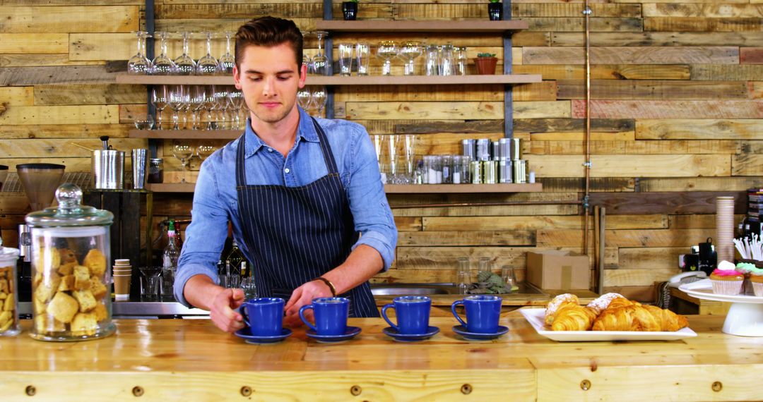 Barista serving coffee in rustic cafe - Free Images, Stock Photos and Pictures on Pikwizard.com