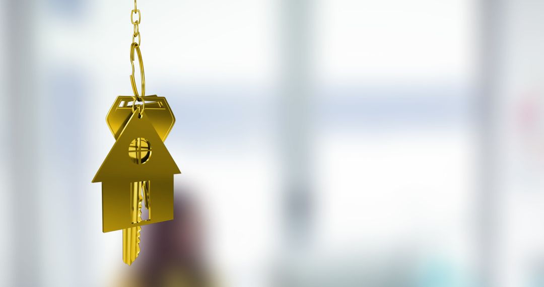 Gold House Key Hanging Against Blurred Background Symbolizing Homeownership
