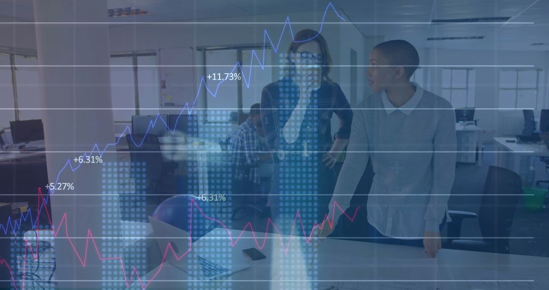 Colleagues Analyzing Financial Growth Using Digital Data Interfaces