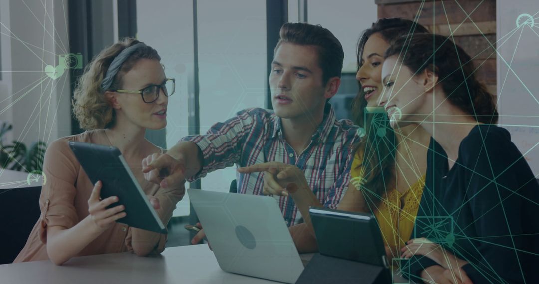 Collaborative Team Working on Digital Technology Project in Office