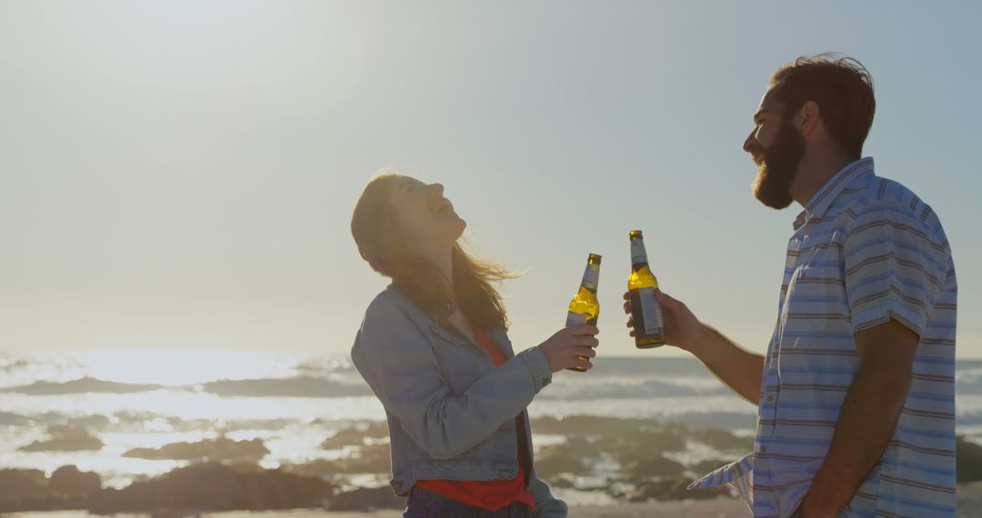 Couple Enjoying Sunset Drinks on Beach - Free Images, Stock Photos and Pictures on Pikwizard.com