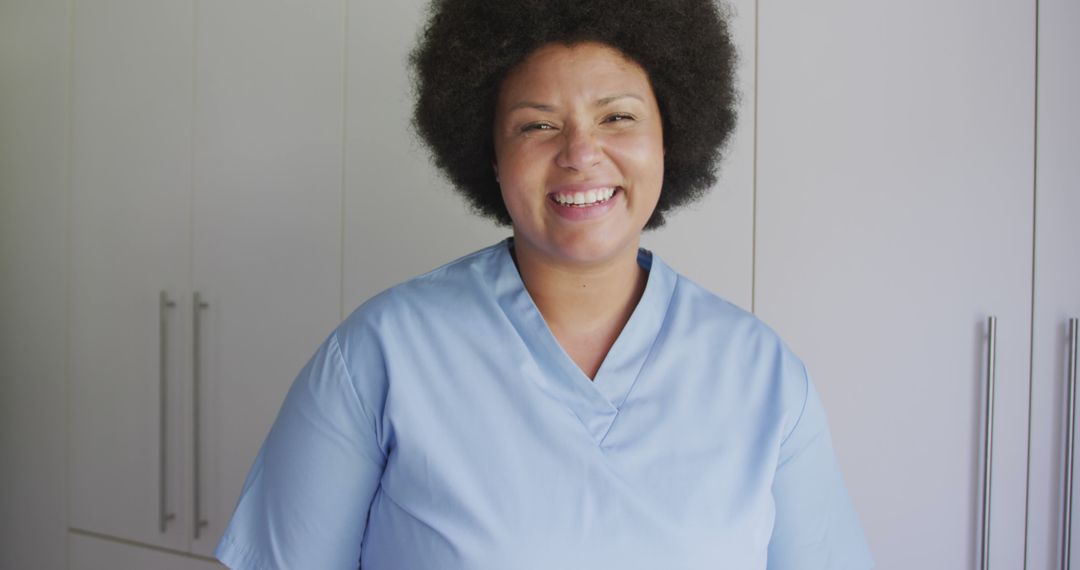 Smiling African American Nurse in Blue Scrubs - Free Images, Stock Photos and Pictures on Pikwizard.com