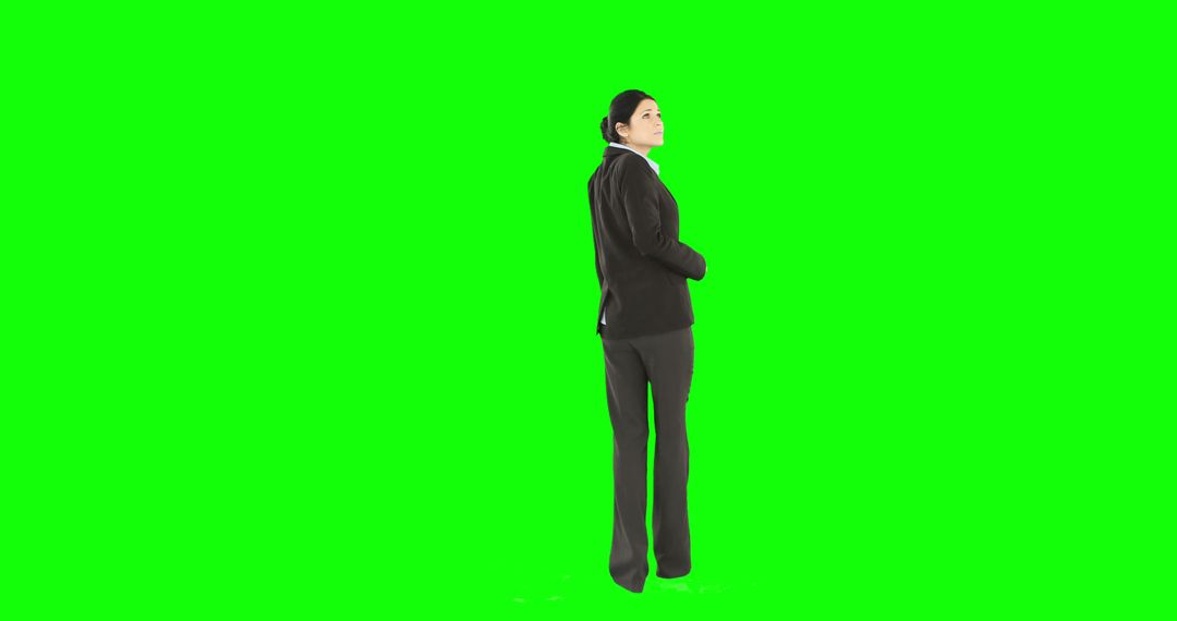 Confident Professional Woman Wearing Suit on Green Background - Free Images, Stock Photos and Pictures on Pikwizard.com