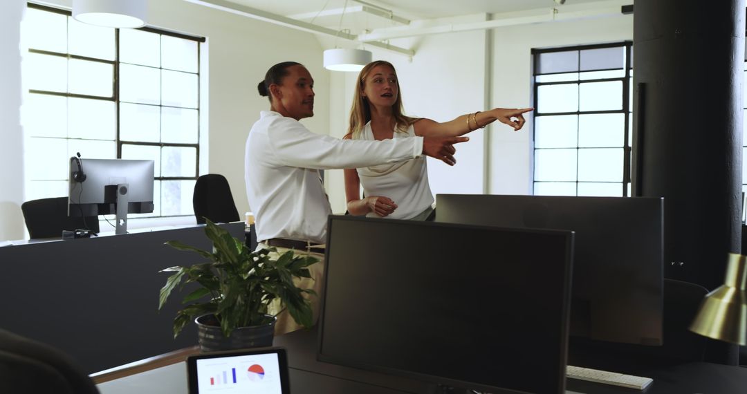 Diverse Business Professionals Engaging in Project Discussion