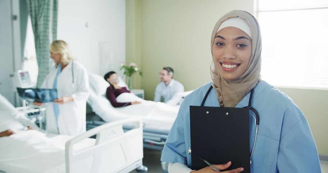 Smiling Muslim Nurse in Hospital Ward Attending Patients - Free Images, Stock Photos and Pictures on Pikwizard.com