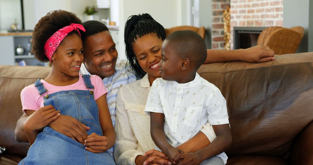 Happy African American Family Spending Quality Time on Couch at Home - Free Images, Stock Photos and Pictures on Pikwizard.com