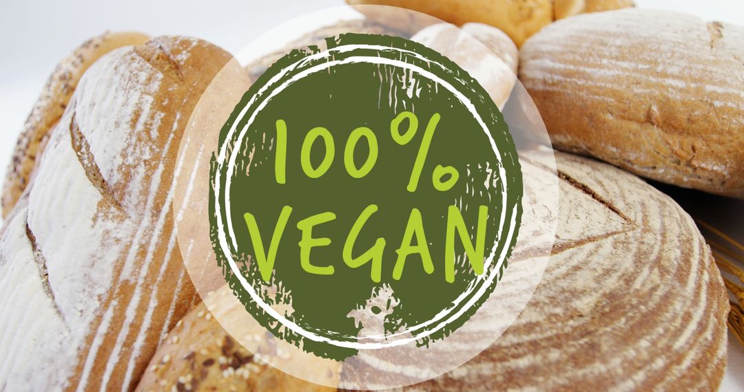 Image of 100 percent vegan text over fresh bread - Free Images, Stock Photos and Pictures on Pikwizard.com