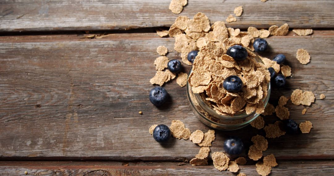 Healthy Wheat Bran Cereal with Fresh Blueberries on Rustic Wooden Table - Free Images, Stock Photos and Pictures on Pikwizard.com