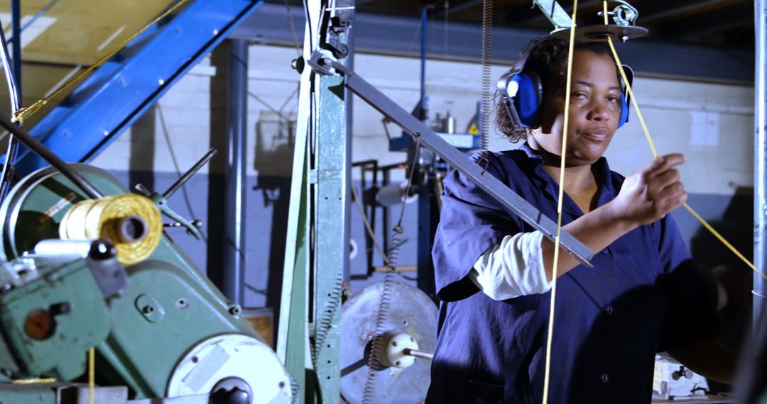 Woman Working in Industrial Factory Wearing Safety Gear - Free Images, Stock Photos and Pictures on Pikwizard.com