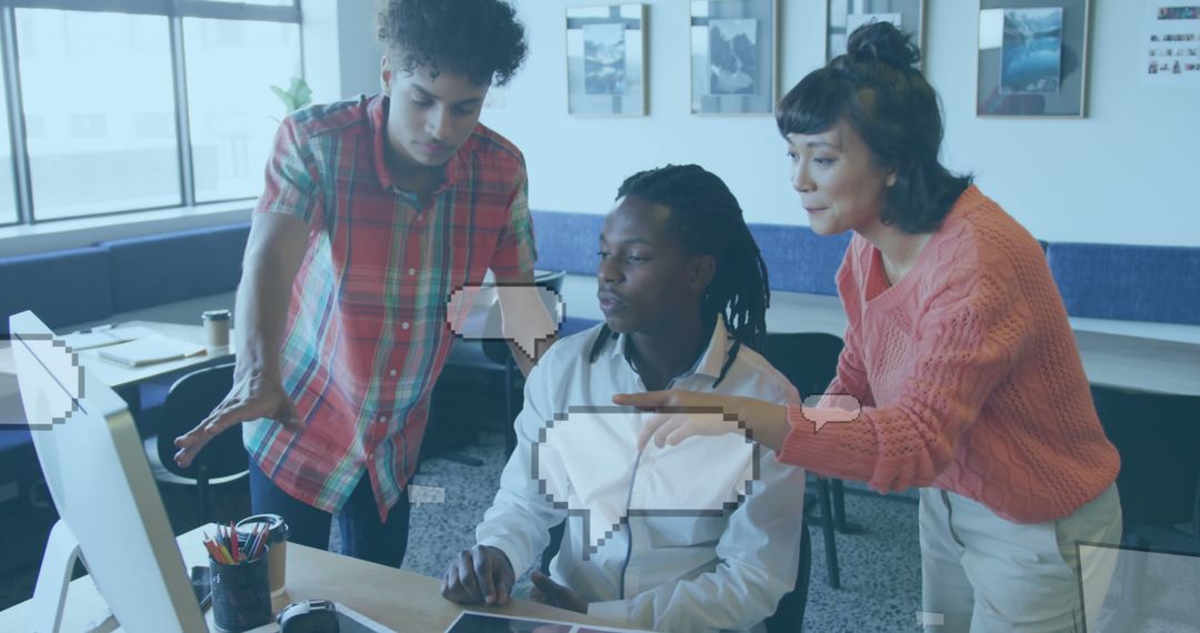 Multicultural Group Collaborating Around Computer in Modern Office