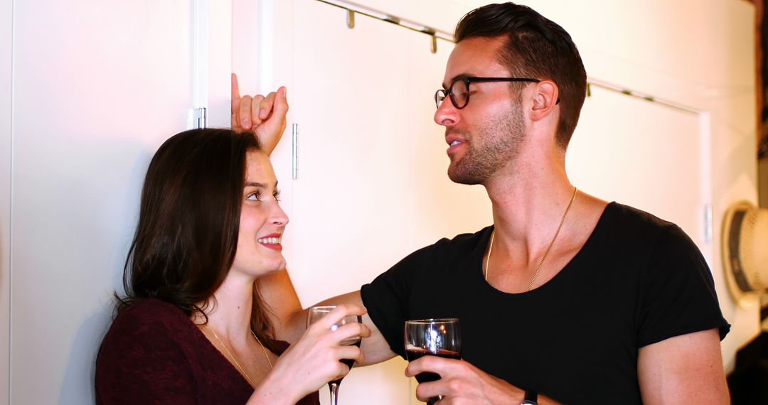 Couple Enjoying Red Wine Interaction at Home