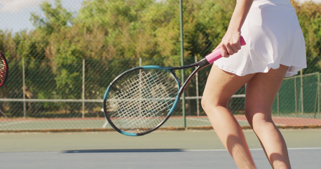Image of midsection of diverse female tennis players holding rackets and clapping hands - Free Images, Stock Photos and Pictures on Pikwizard.com