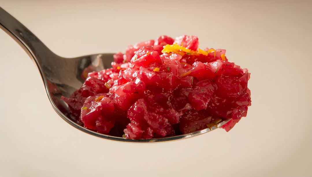 Bright Beetroot Relish on Spoon with Citrus Zest Macro Glossy Condiment Close-Up Texture