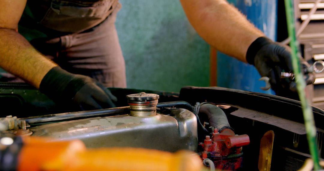 Mechanic Performing Car Radiator Maintenance - Free Images, Stock Photos and Pictures on Pikwizard.com