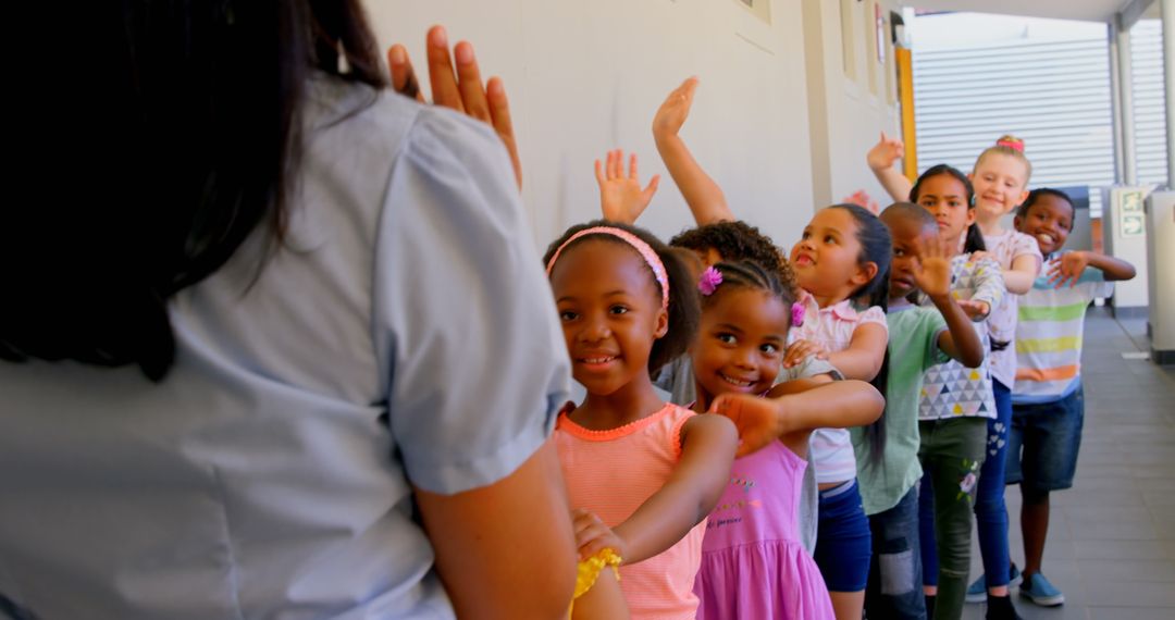 Joyful Schoolchildren Waving in Corridor Queue